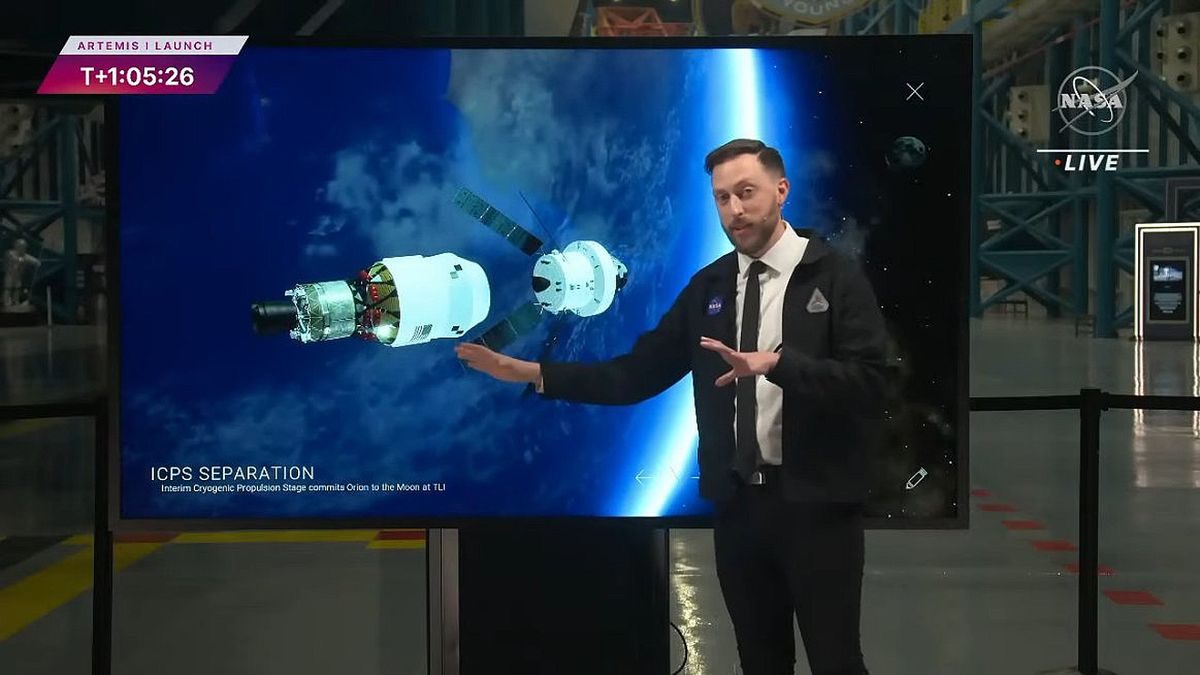 NASA&#039;s Dan Huot stands in front of the interactive Moonboard.