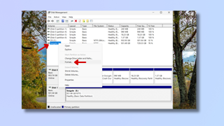 A screenshot of the Disk Management tool on Windows, with red arrows pointing at a hard drive and at Format. 