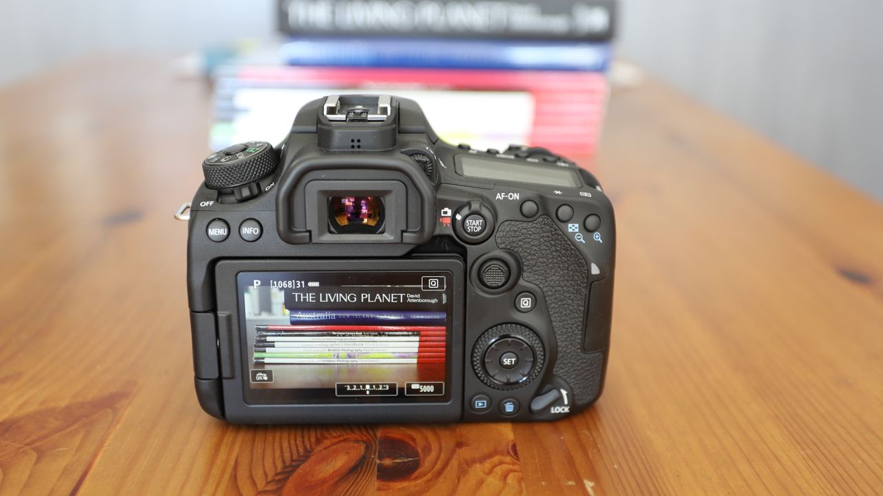 Canon EOS 90D DSLR on a table, rear screen