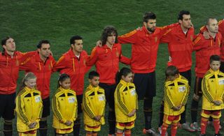 Spain players look on during the Spanish national anthem ahead of the 2010 World Cup final against the Netherlands in South Africa.