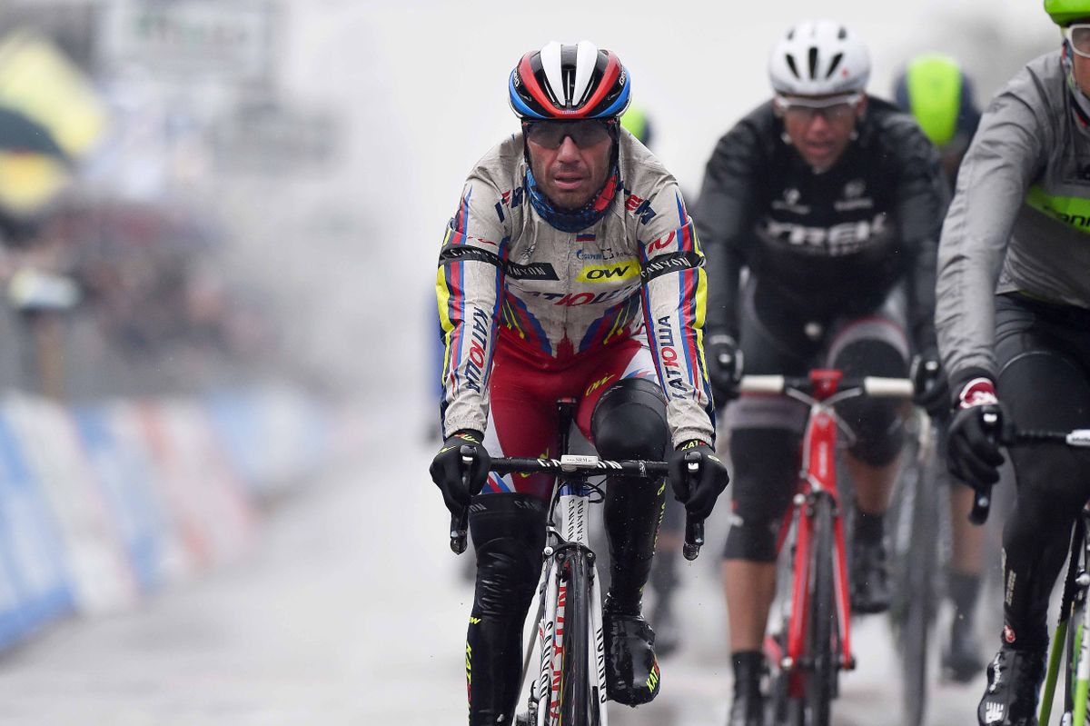 A wet Joaquim Rodriguez (Katusha) crosses the line