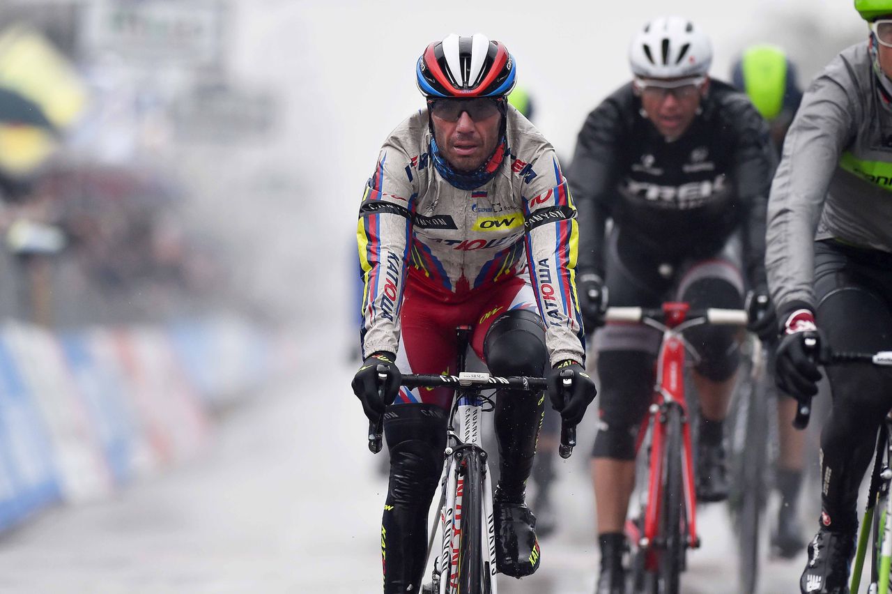 A wet Joaquim Rodriguez (Katusha) crosses the line