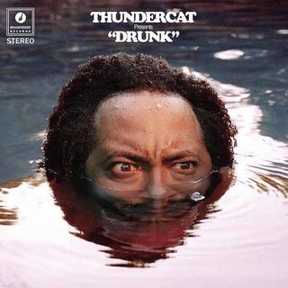 Thundercat Drunk album shows a man in a pool, submerged from the nose down