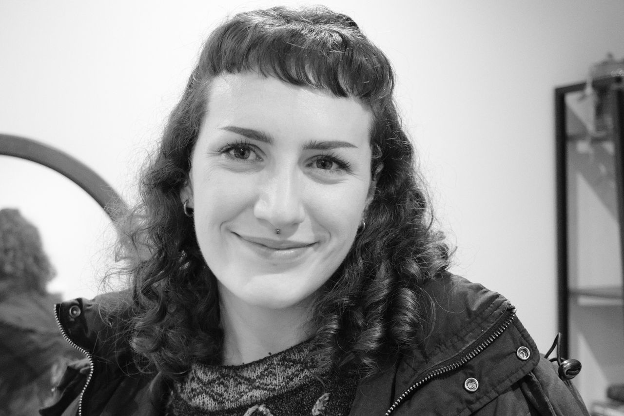 A photo of a woman smiling taken on a Fujifilm X-M5 camera