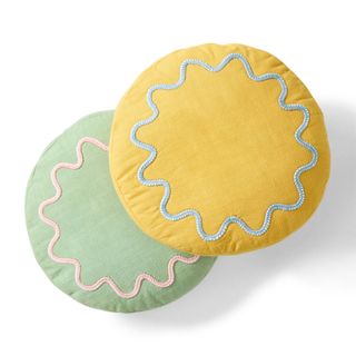 Two round yellow and green throw pillows