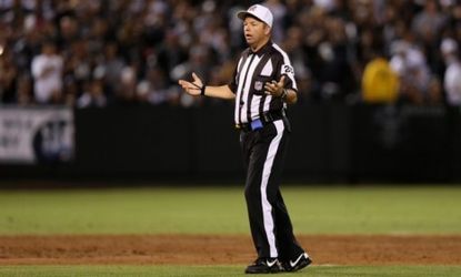 Replacement referee Jim Core questions a call during the season opening game between the San Diego Chargers and the Oakland Raiders on Sept. 10.