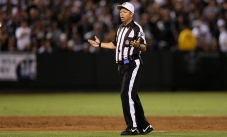 Replacement referee Jim Core questions a call during the season opening game between the San Diego Chargers and the Oakland Raiders on Sept. 10.