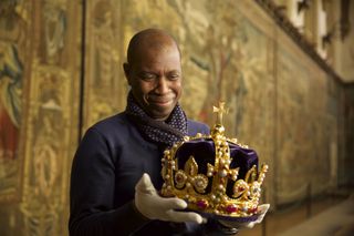 Clive Myrie holding 'Henry's Crown'