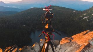 Power bank on top of camera provides to the Sony A7 II via a dummy battery cable