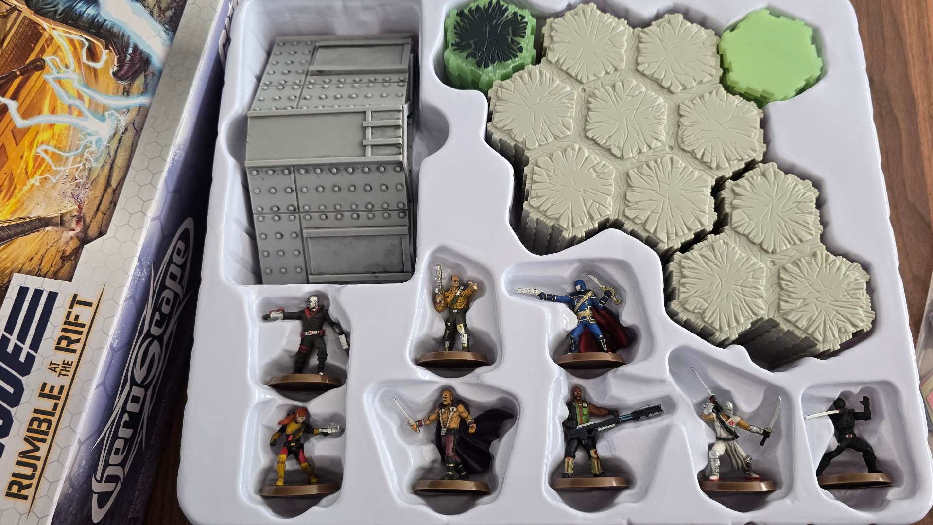 Models and terrain tiles in packaging from G.I. JOE Heroscape: Rumble at the Rift