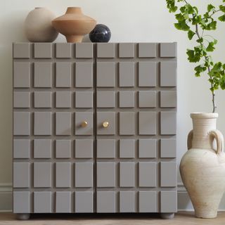 Grey Ikea IVAR cupboard in grey with raised squares.