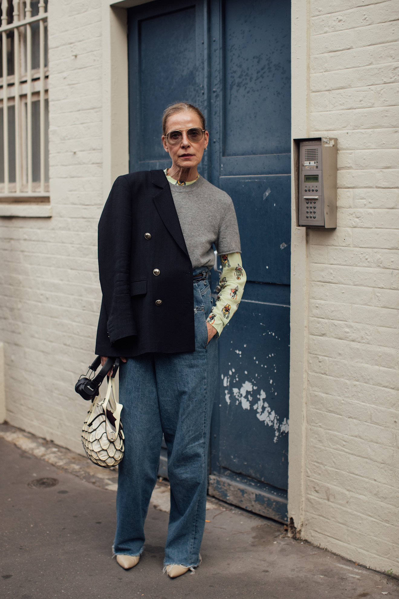 Woman wearingwide-leg jeans and a layered top