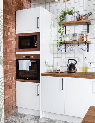 kitchen makeover brick island-grey patterned floor white unit