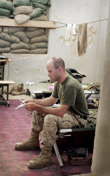 A US Navy Corpsman reads a letter.