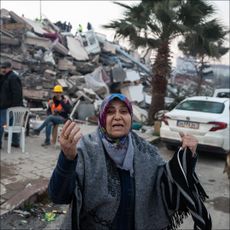 A woman yells as she waits for news of their loved ones, believed to be trapped under collapsed building on February 08, 2023 in Hatay, Turkey. A 7.8-magnitude earthquake hit near Gaziantep, Turkey, in the early hours of Monday, followed by another 7.5-magnitude tremor just after midday. The quakes caused widespread destruction in southern Turkey and northern Syria and were felt in nearby countries.