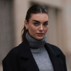 best mascara for volume - woman with a ponytail looks at the camera gettyimages 1784228060