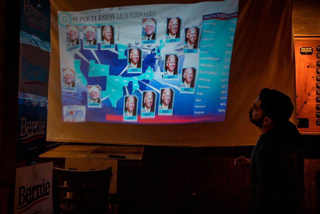 Sanders supporter looks at Super Tuesday map