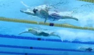 Ariarne Titmus and Katie Ledecky swimming