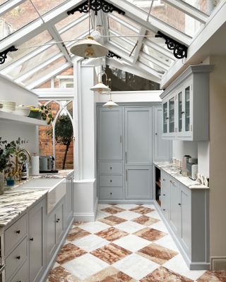 Grey kitchen with checkerboard flooring