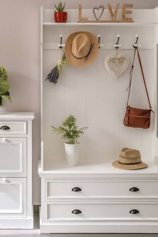 Boot room with white furniture