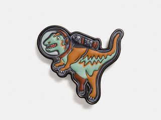 Some joke that the dinosaurs went extinct because they never made it to space before an asteroid could wipe them out. Well, Coach is giving dinosaurs another chance at space with their new space-themed collection of clothing and accessories. This Tyrannosaurus Rex hangtag is one of the more affordable items of the line. ($35 at Coach.com)