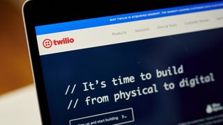 Twilio website featuring logo and branding pictured on a laptop screen.
