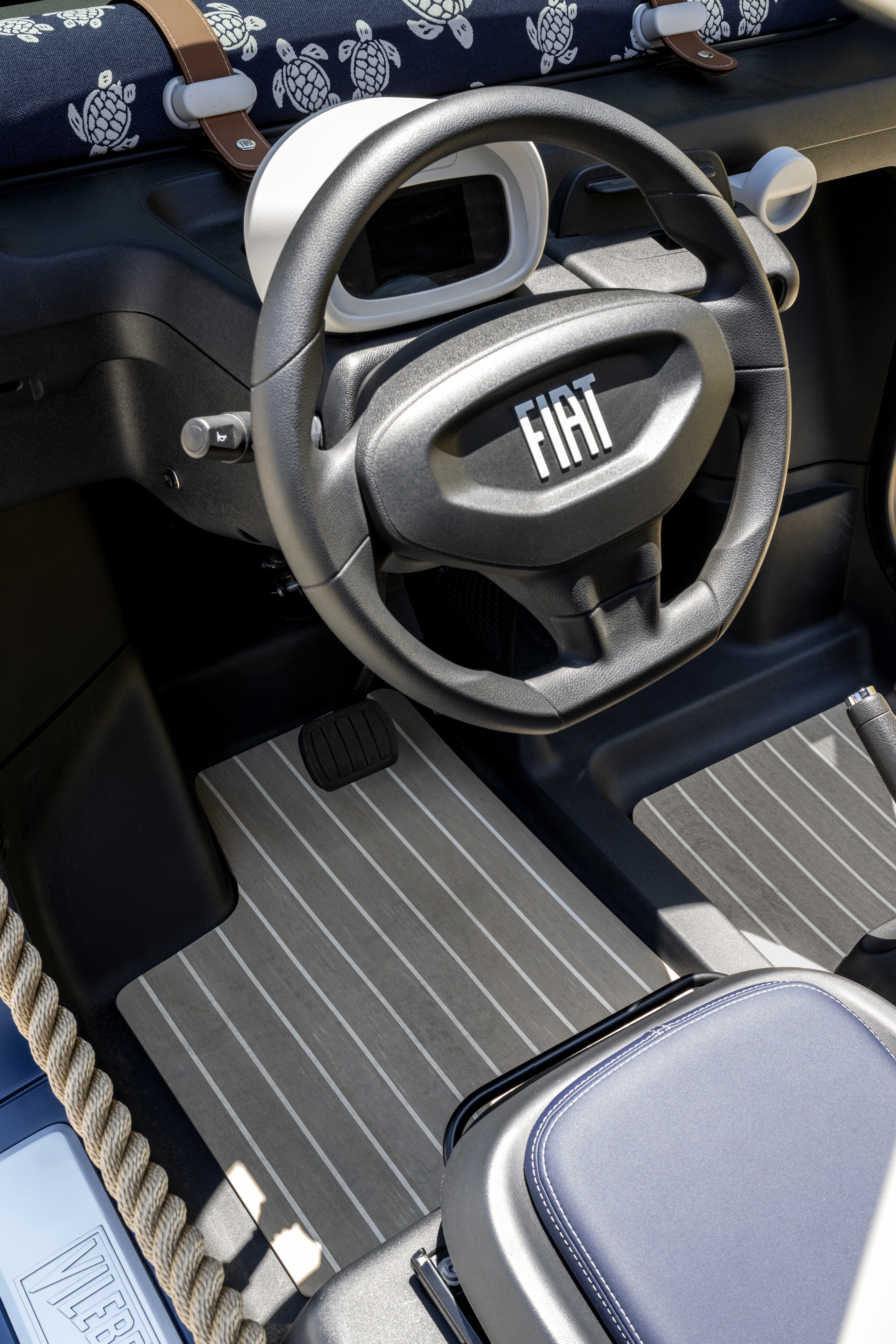Tiny navy and white car
