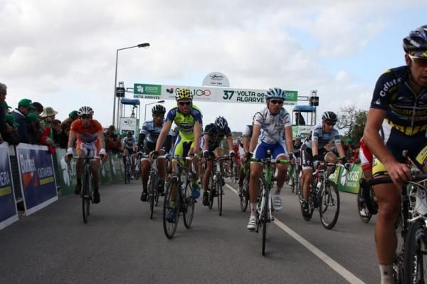 The peloton rolls across the finish line.