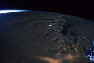 NASA astronaut Scott Kelly captured this rare view of "thundersnow" in a blizzard battering the U.S. East Coast on Saturday (Jan. 23) from a window on the International Space Station. 