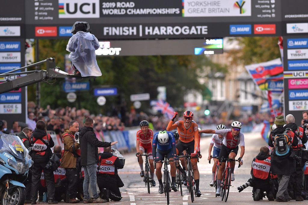 Nils Eekhoff celebrates after the finish of the U23 road race