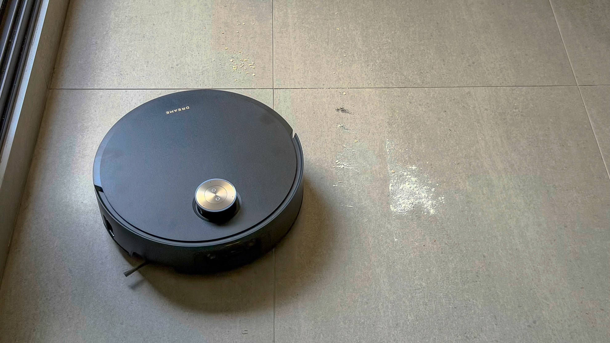 Dreame Aqua10 Ultra robot vacuuming flour off tile flooring