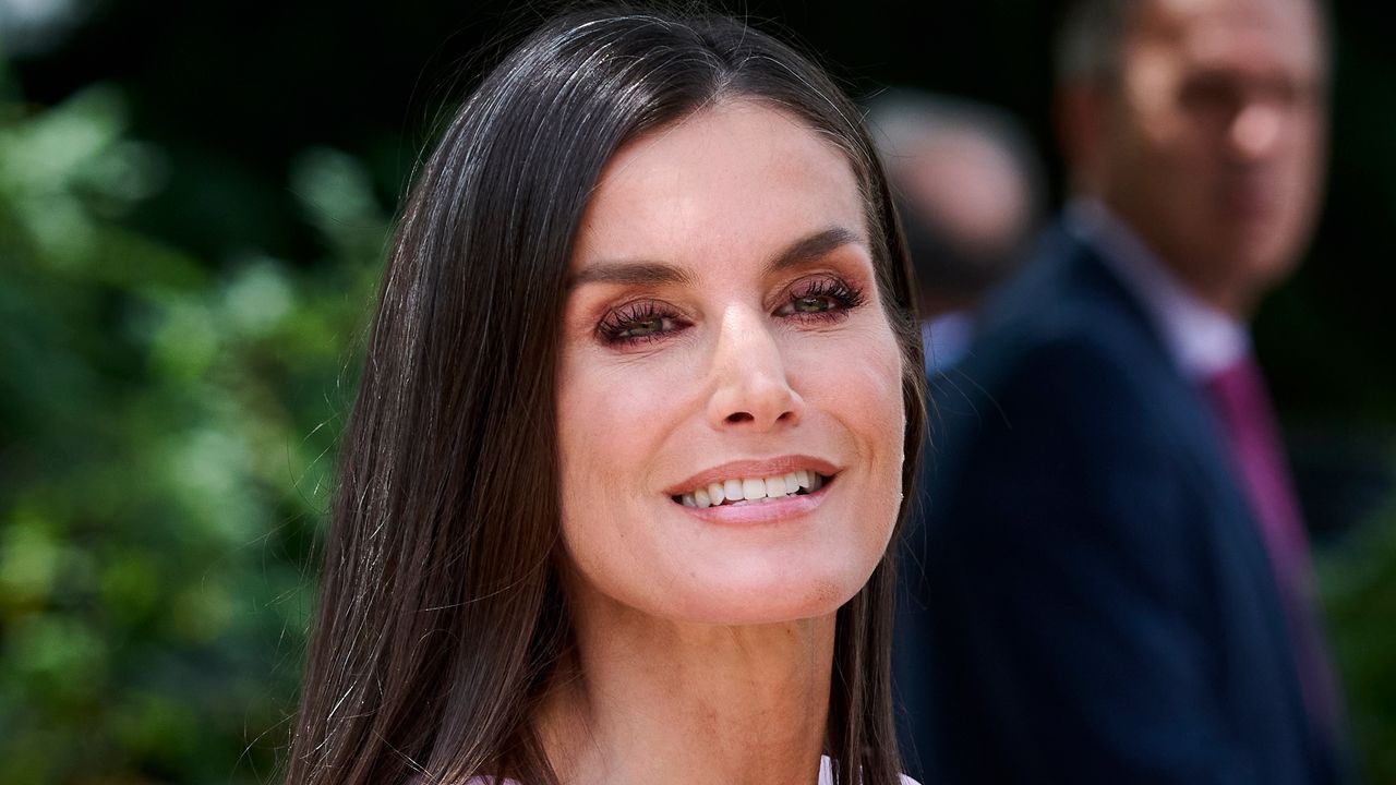 Queen Letizia of Spain’s petal pink blouse as she attends the confirmation of Princess Sofia of Spain