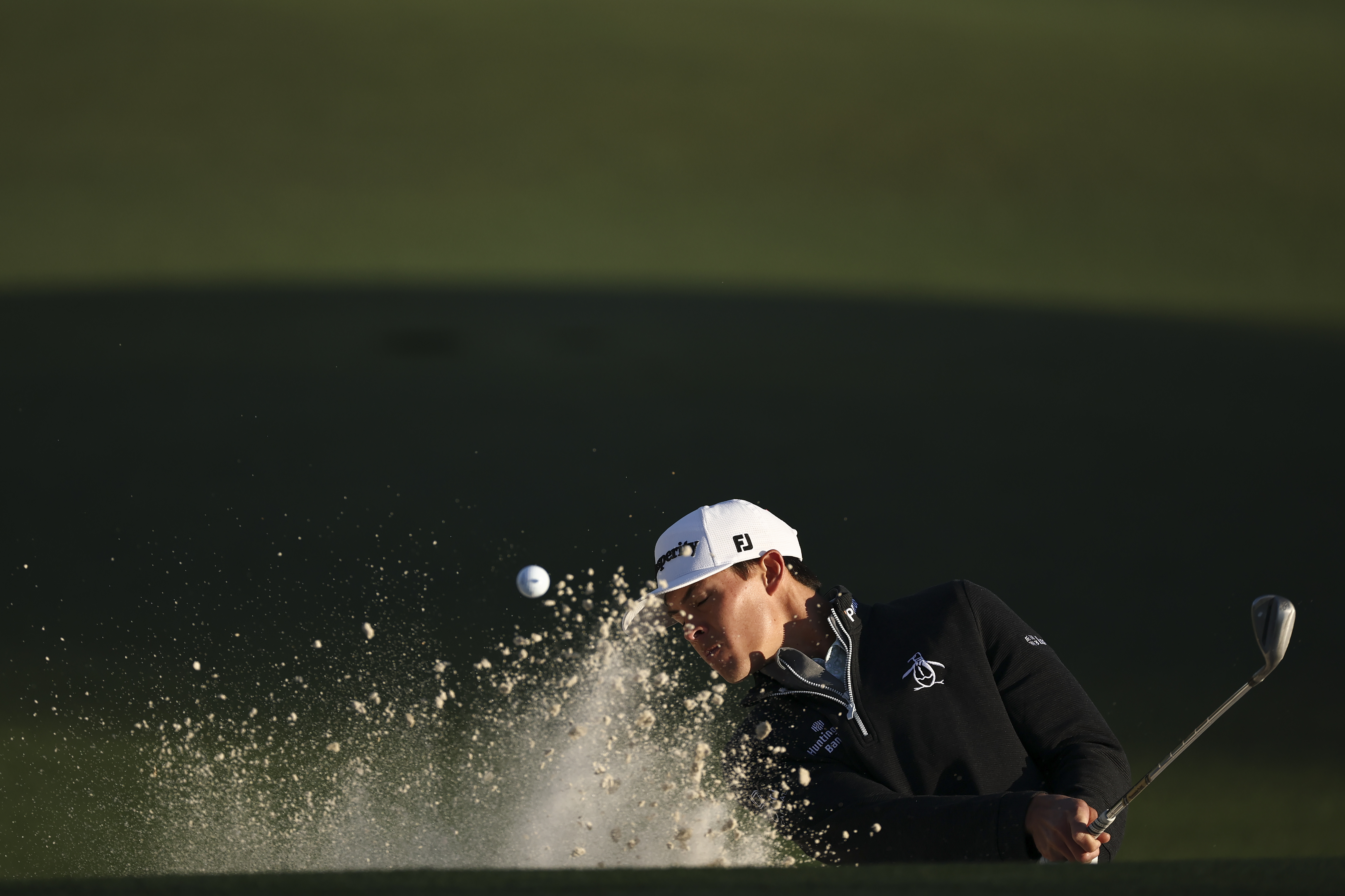 Johnny Keefer plays a shot from a bunker on the second hole during the first round of the 2026 Masters Tournament at Augusta National Golf Club