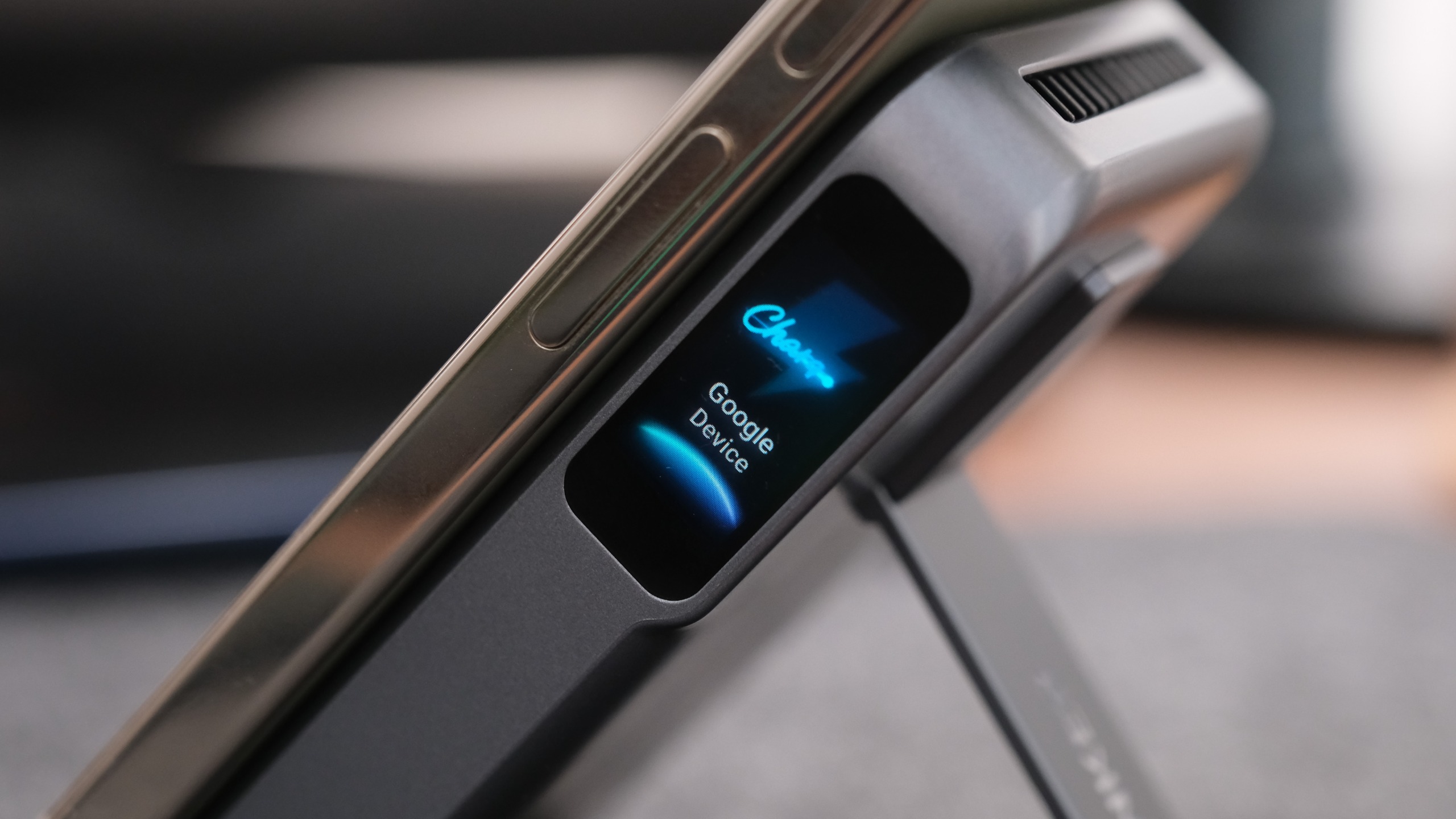 Close-up of the Anker MagGo Power Bank 2 Pro attached to a smartphone, with the display indicating that a Google device is charging.
