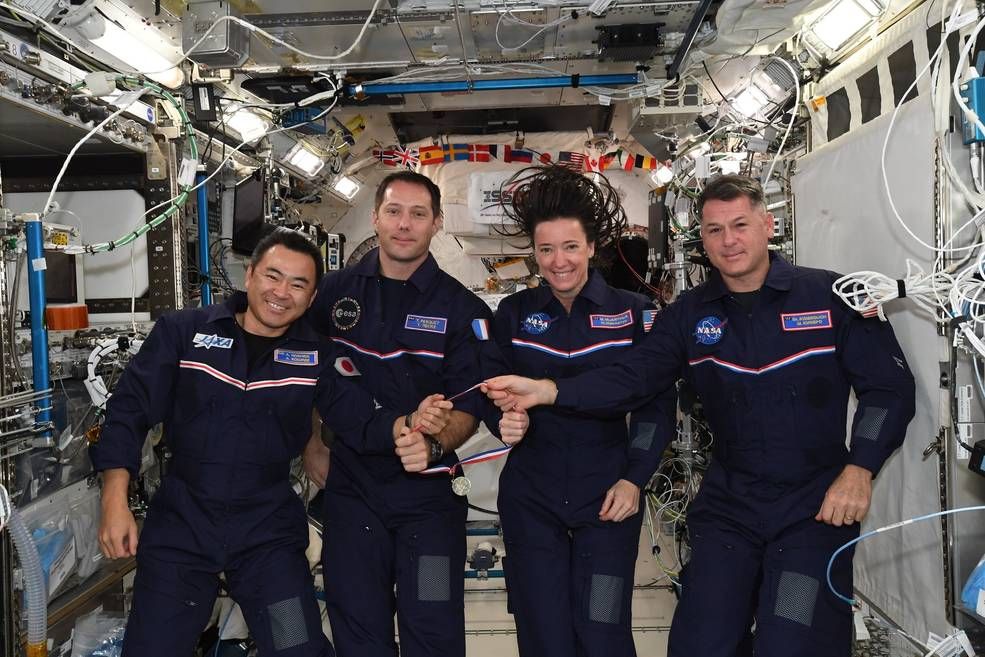 NASA SpaceX Crew-2 astronauts Akihiko Hoshide of JAXA (Japan Aerospace Exploration Agency), left, Thomas Pesquet of ESA (European Space Agency), and Megan McArthur and Shane Kimbrough of NASA participate in the Space Olympics onboard the International Space Station.