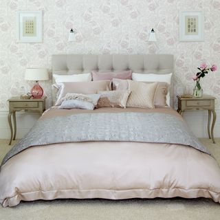 bedroom with wallpaper and bedlinen