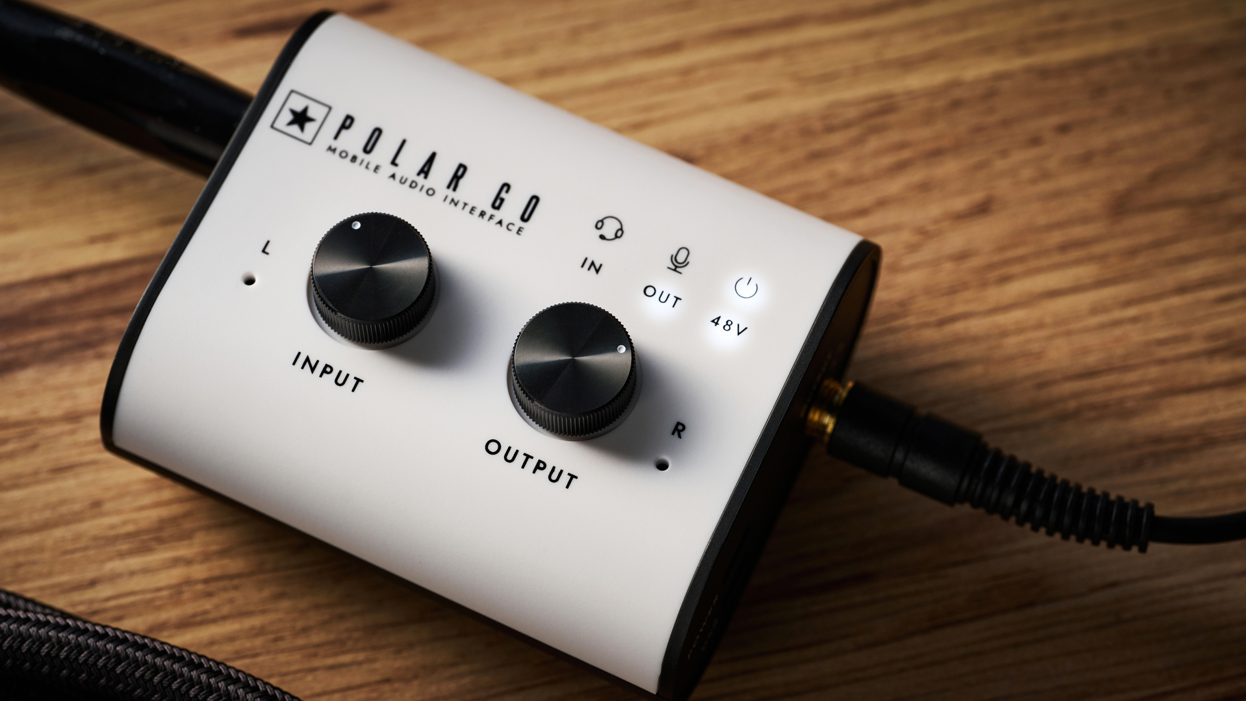 A Blackstar Polar Go audio interface on a wooden desk