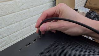 A screenshot of a mryeester/Adam Lee video, showing a PC case modification that uses the audio jack socket to power on the PC