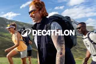 Decathlon new logo in use, a woman walking with the logo over the top of her image