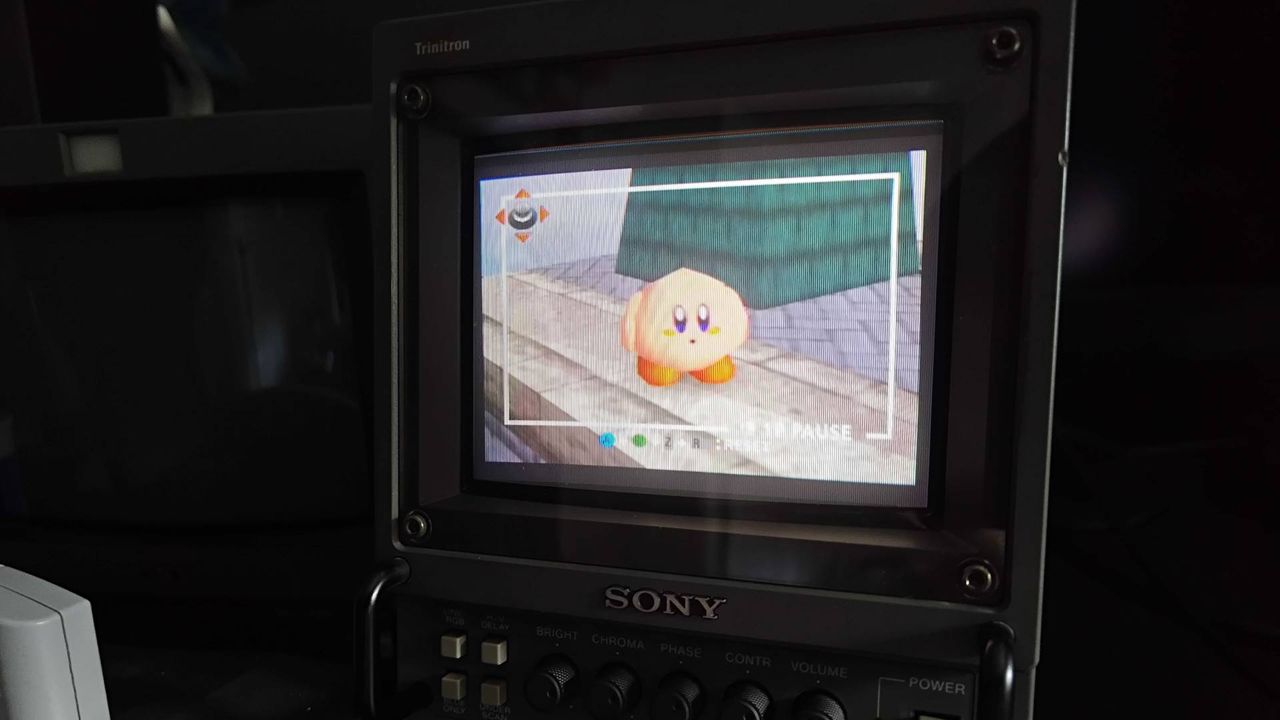 Sony Trinitron PVM CRT with Super Smash Bros gameplay N64 gameplay on screen via decent quality composite cable correct brightness and colors.