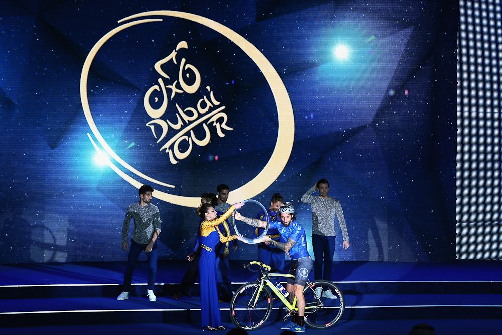 Artists perform during the team presentation show ahead of the Tour of Dubai