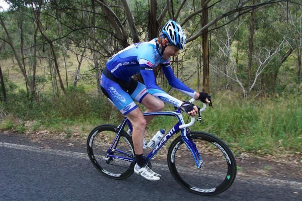 Brendan Brooks from Shortis.com.au squad shows a display of pain as the climbing sets in for a mountain top finish.