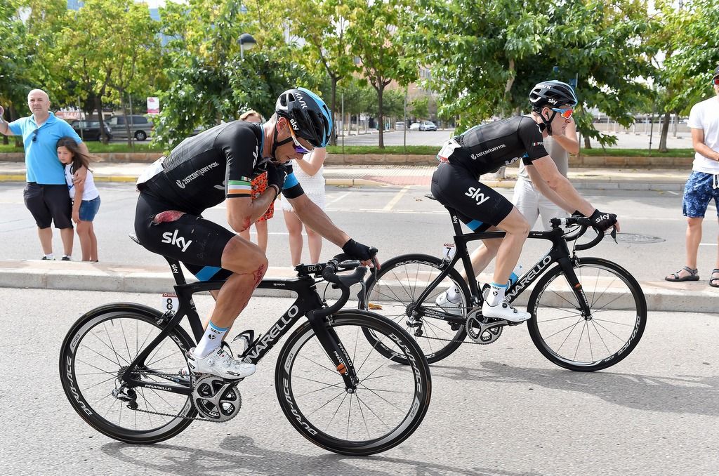 Nico Roche (Team Sky) on the radio as he chases back on