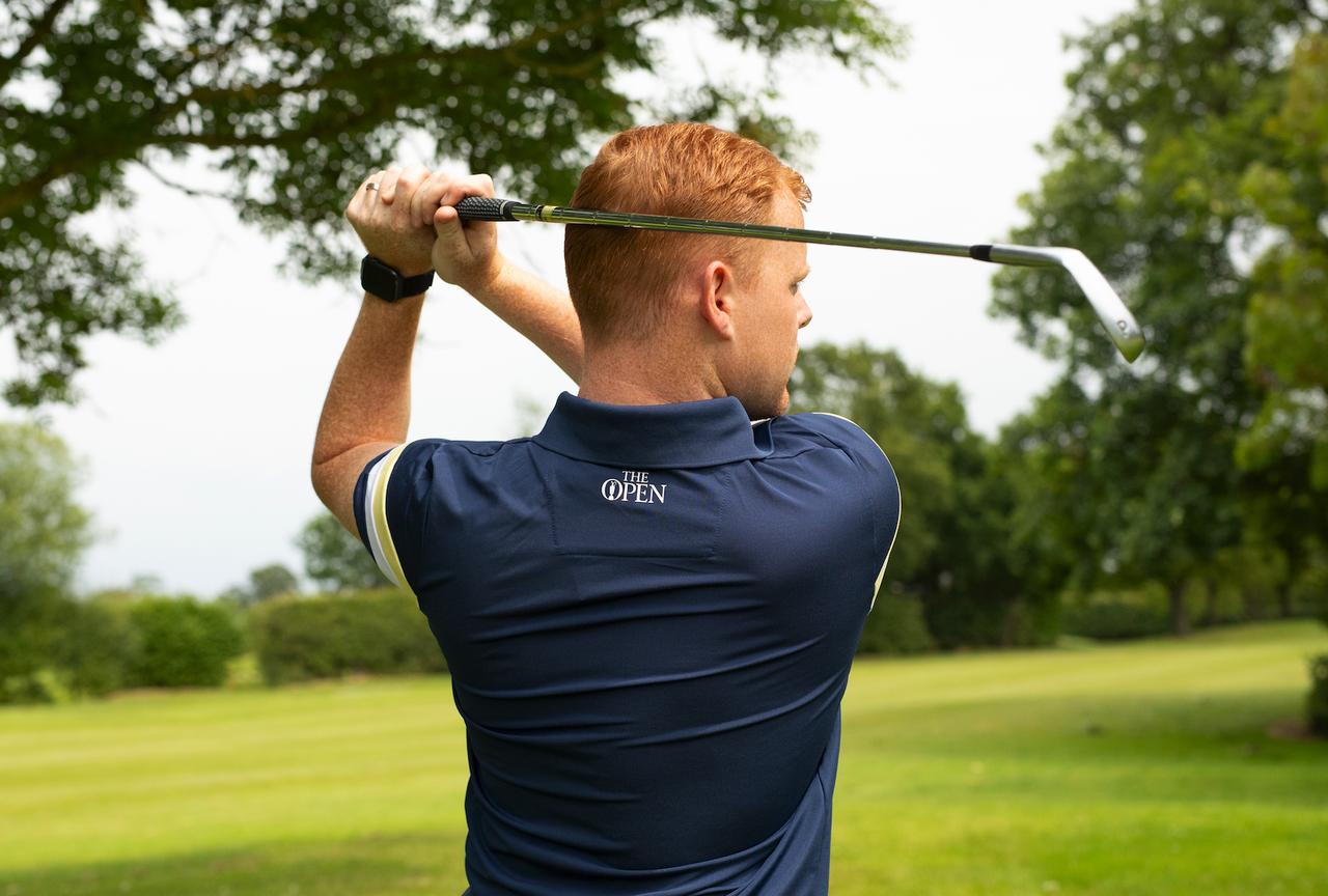 A man holds his finish on an iron shot