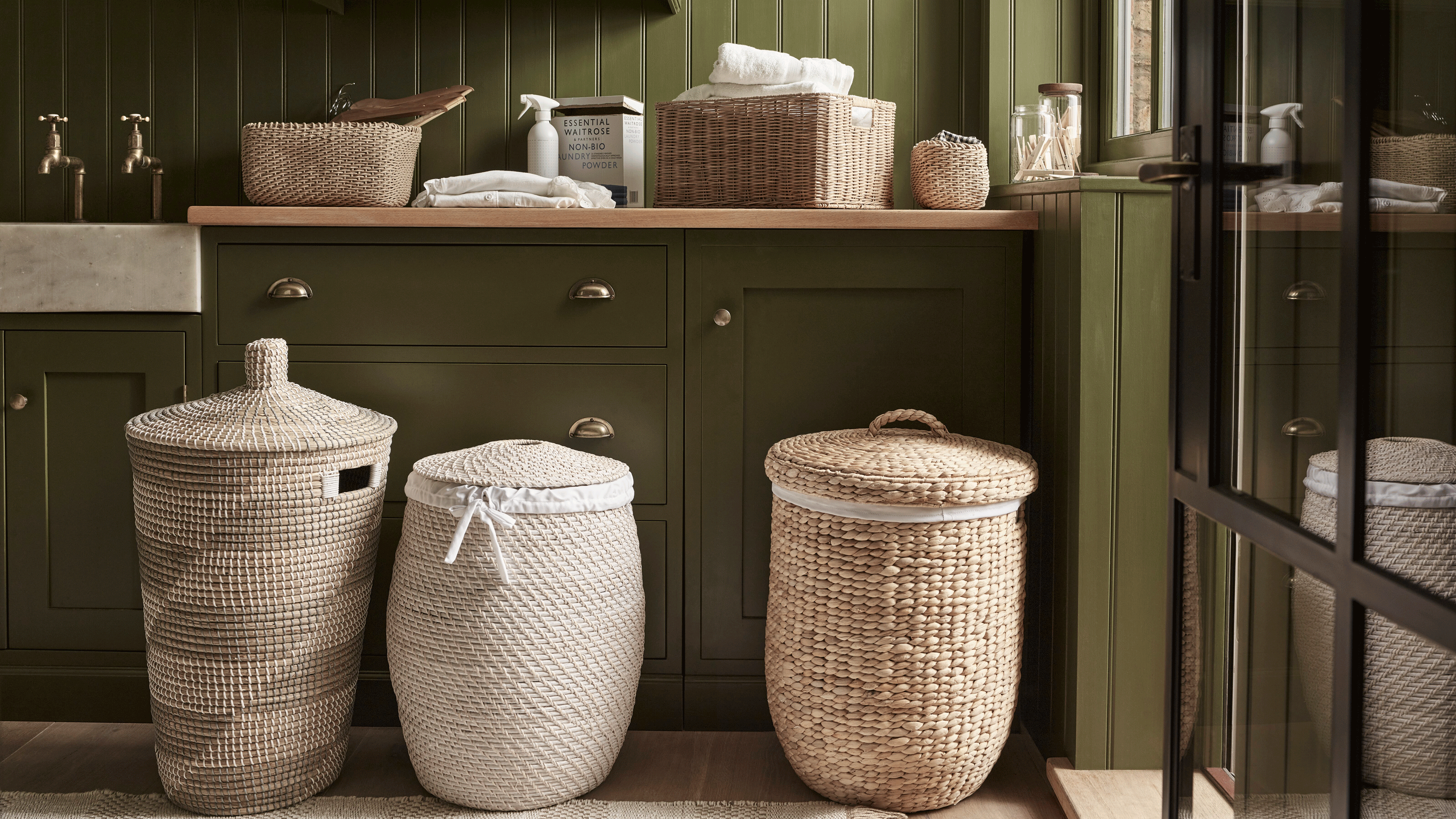 Green utility room with straw storage baskets