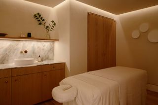 Sage + Sound New York spa treatment room with massage bed