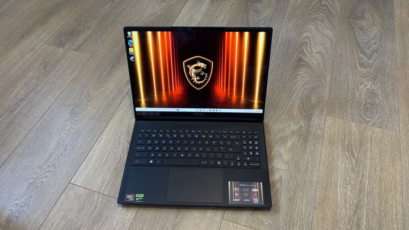 MSI Stealth A16 AI+ on wooden surface