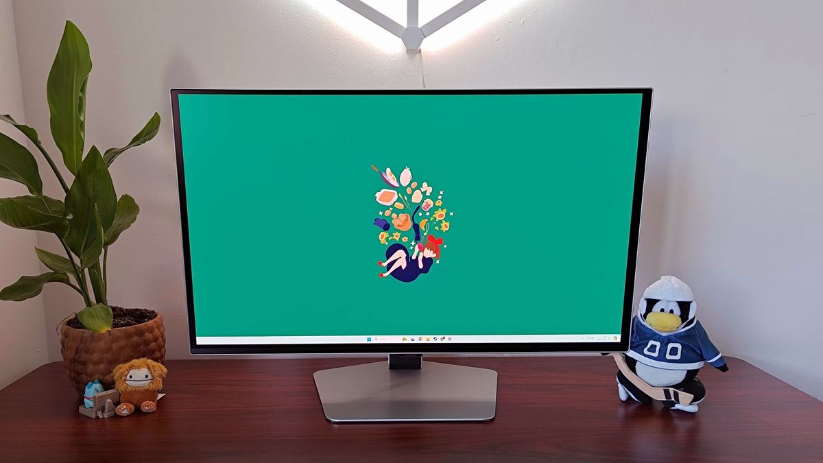 Samsung Odyssey OLED G6 with green Kiki's Delivery Service wallpaper on Windows 11 desktop