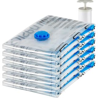 stack of six folded clear vacuum seal bags with hand pump in background