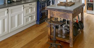 kitchen with wooden butchers block and unique bar stools to highlight tips for buying second hand furniture